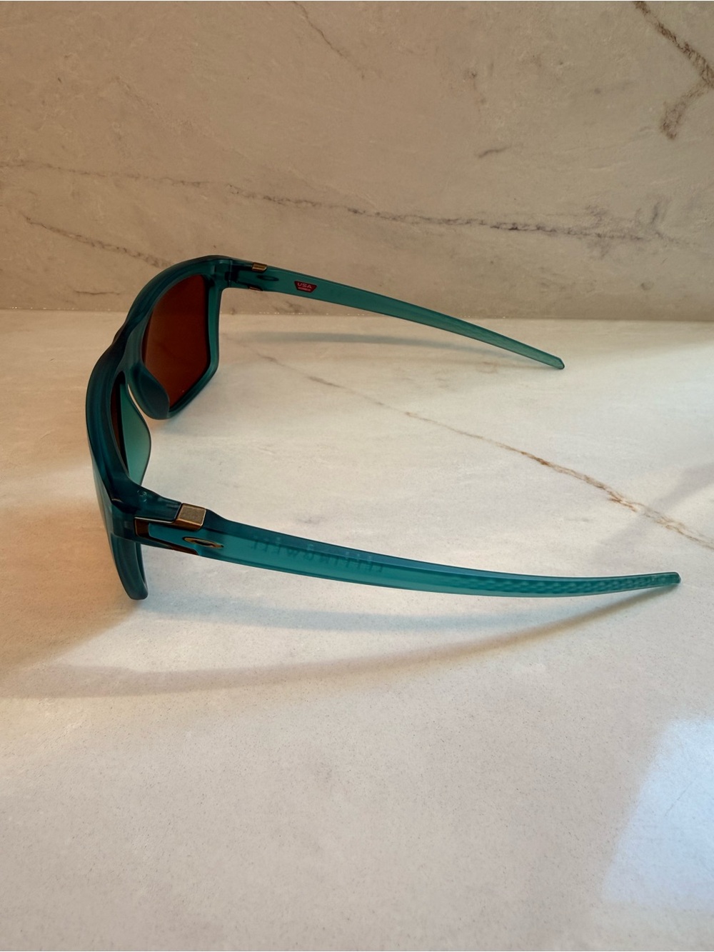 Oakley Teal Frame Sunglasses with Amber Lenses